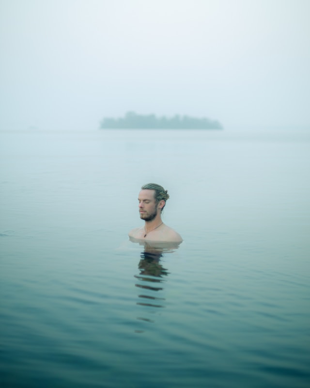 A guy meditating in the water