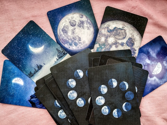 tarot cards with the different phases of the moon on the back