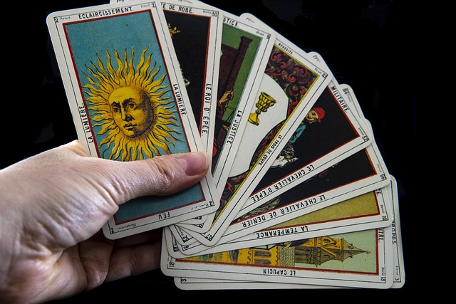 Tarot cards with the top card having an image of the sun